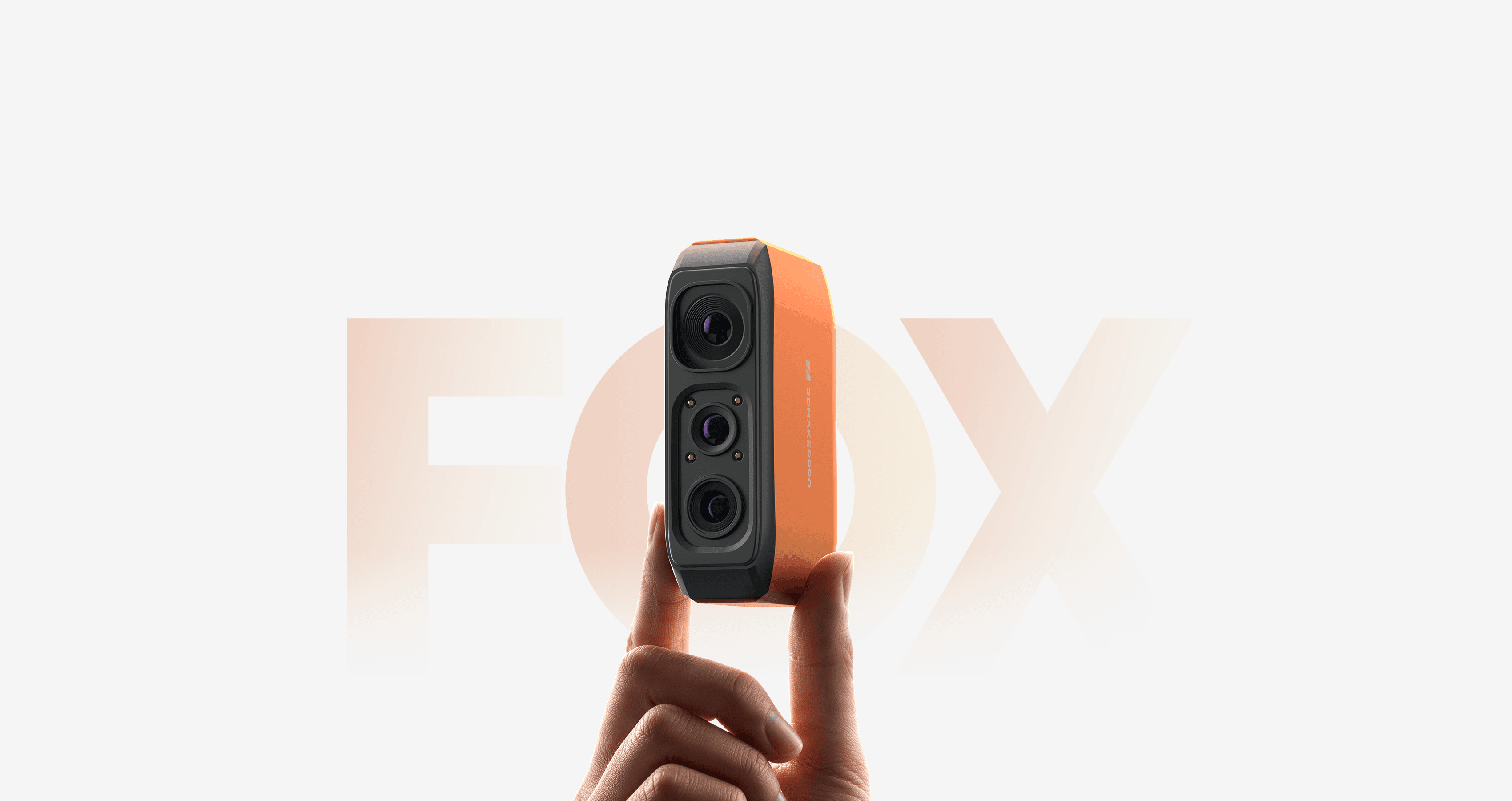 210g ultralight 3DMakerpro Fox 3D Scanner in bright orange, easily held by two fingers.