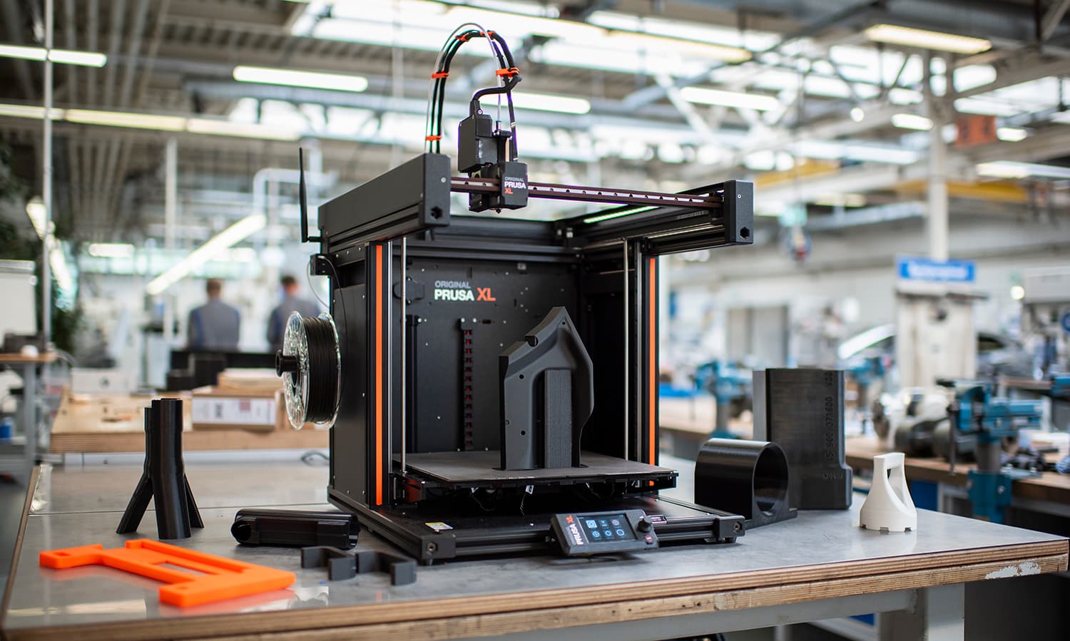 Prusa XL+ large-format 3D printer with 3D printed architectural mockups on a workbench